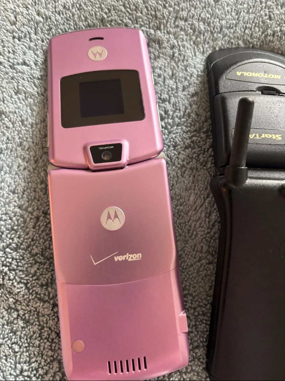 Vintage Collection of cell phones includes StarTAC and Pink Flip